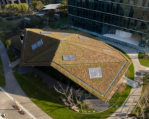 kengo kuma tops novartis building in shanghai with folded green roof