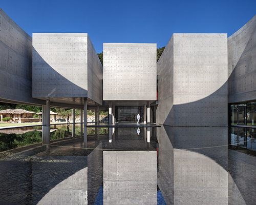 atelier KOMA houses korea's son yang won memorial museum inside elevated concrete ring