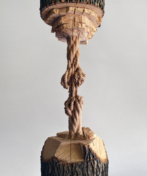 maskull lasserre chisels giant tree trunk down to a precariously frayed rope