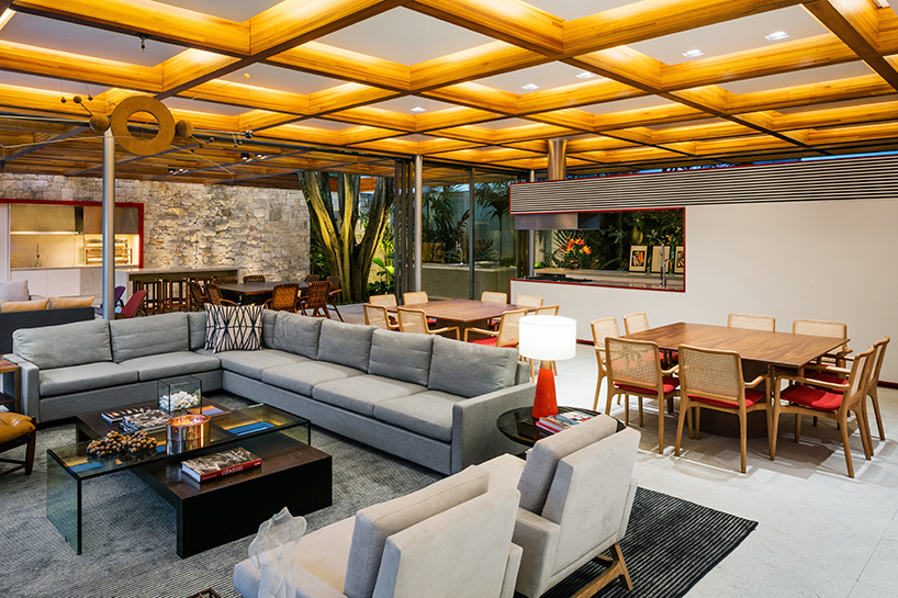 perkins + will builds a tropical house around a tree in são paulo