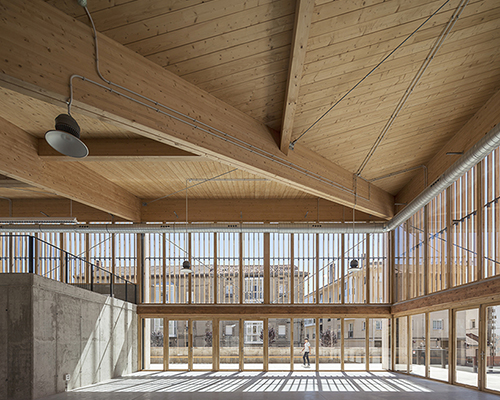 RAW/deAbajoGarcia builds community center in spain as a large timber canopy