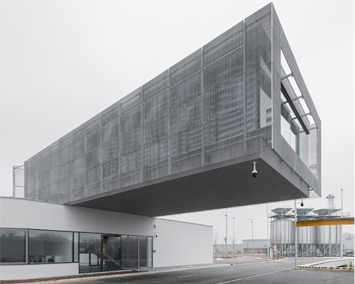 sporaarchitects' control building for the gyor-gonyu port overlooks the danube river