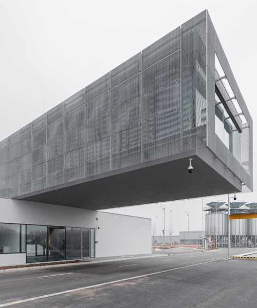 sporaarchitects' control building for the gyor-gonyu port overlooks the danube river