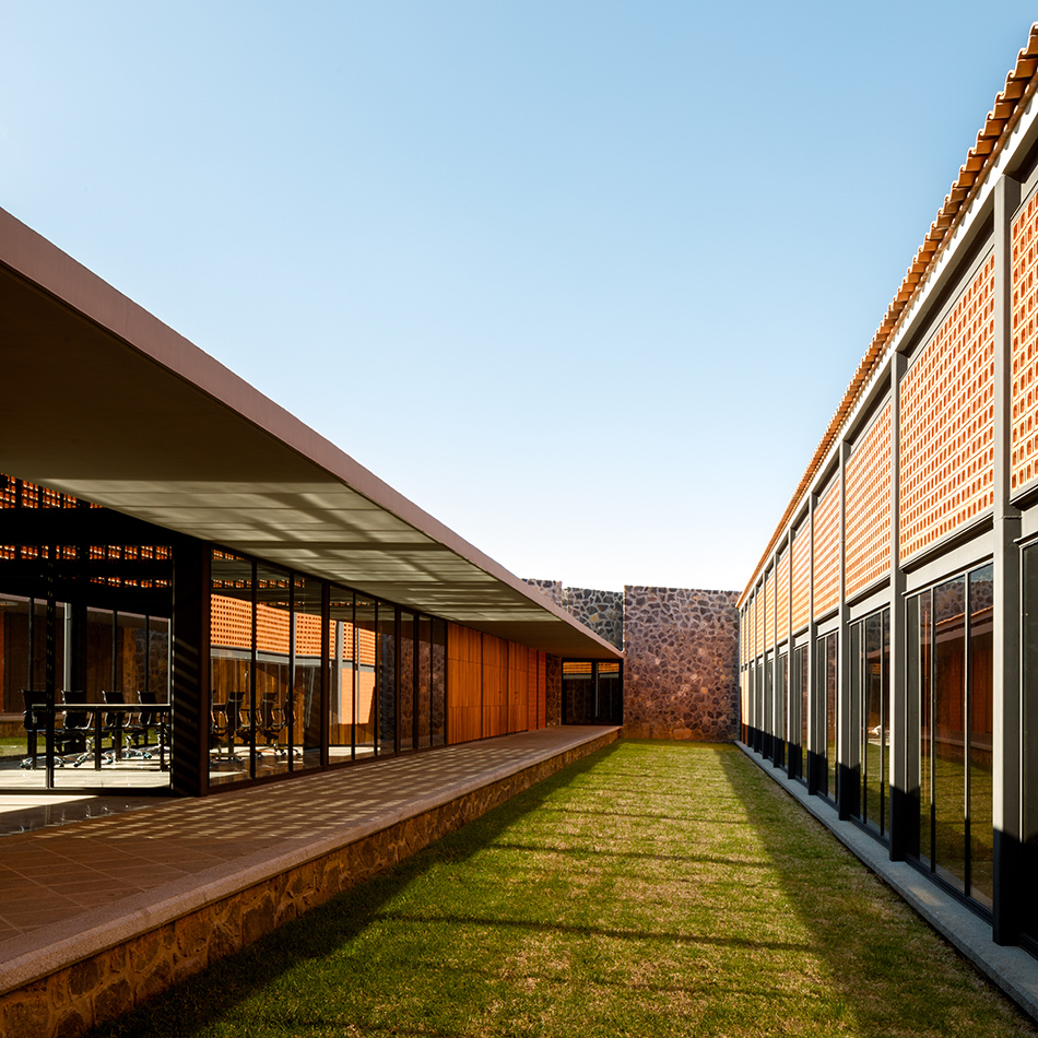 mauricio rocha + gabriela carrillo encircle courthouse in mexico with volcanic stone walls