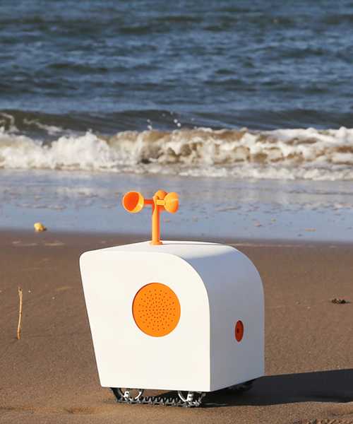 the AI-robot by yuxi liu writes poems on the beach