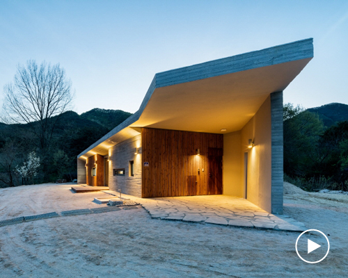 the apple farm house designed by 2m2 architects is inspired by its surrounding natural scenery