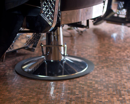 barber shop owner covers floor with 70000 pennies