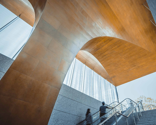 UAP's emergence installation unveils a captivating brass entry canopy