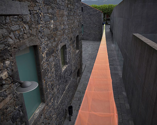 akane moriyama converts a courtyard into an intimate area using textiles to manipulate the context of space