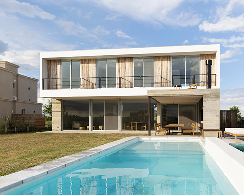 BAM! arquitectura overlaps simple volumes to create pool house in argentina