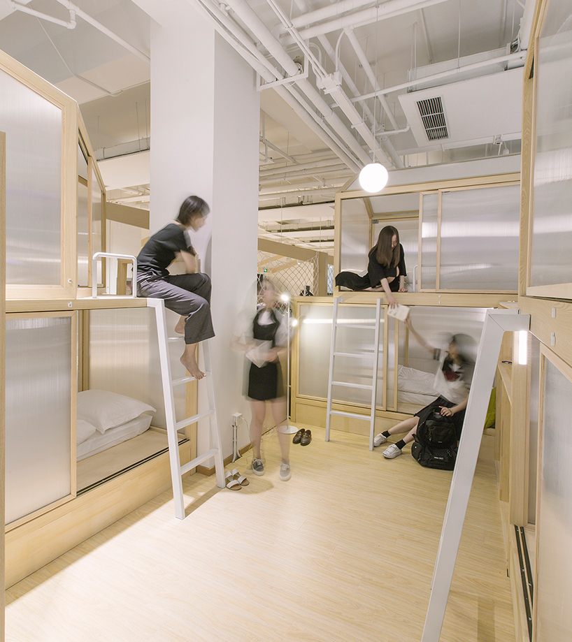cao pu pitches tent structures inside together hostel in beijing