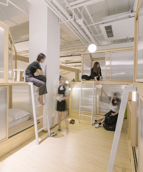 cao pu pitches tent structures inside together hostel in beijing