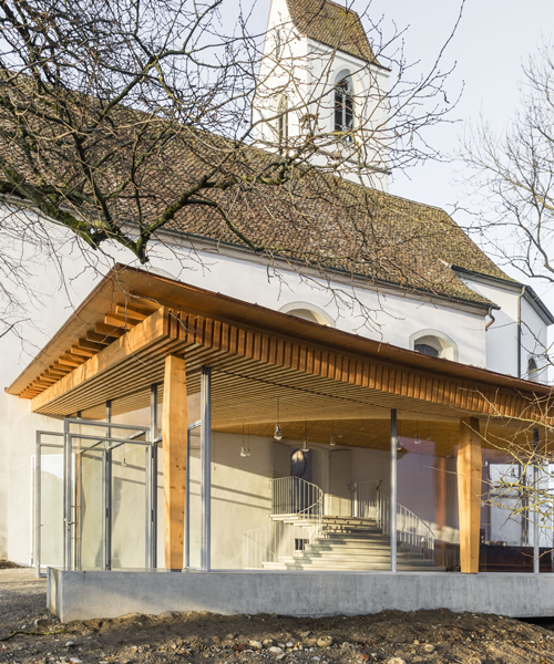 gian salis adds light-filled foyer to historic church in switzerland