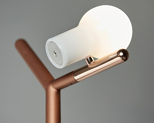 GYRO's myna lamp greets you in the hallway like a bird perched on a branch