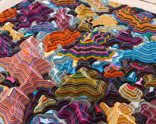 jacob leary's colorful undulating sculptures are reminiscent of topographic land masses