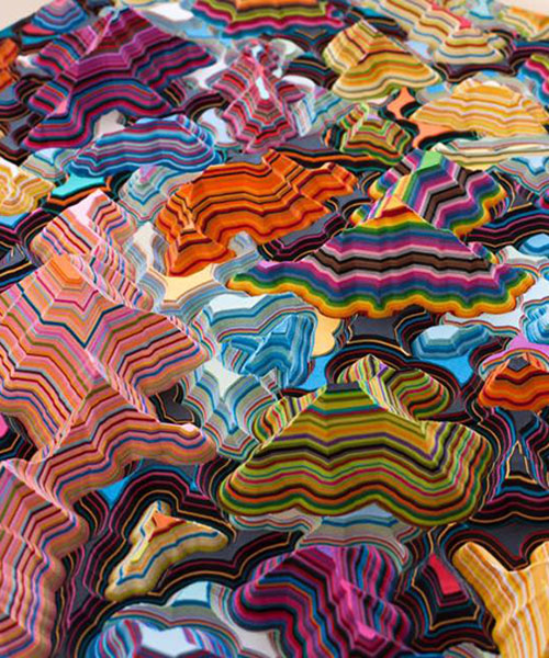 jacob leary's colorful undulating sculptures are reminiscent of topographic land masses