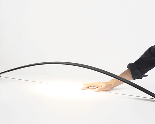 shoot the light on with massess' bo light, a lamp reminiscent of an archers bow