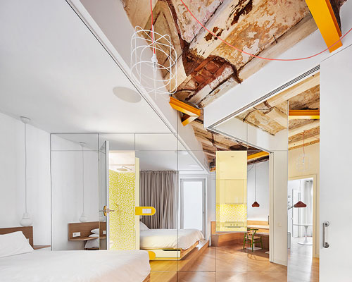 miel arquitectos refurbishes traditional spanish house into a contemporary mirror-clad apartment