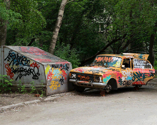 artists 'erase' graffitied car with painted photoshop transparency pattern