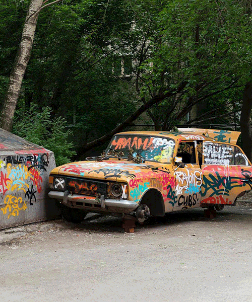artists 'erase' graffitied car with painted photoshop transparency pattern