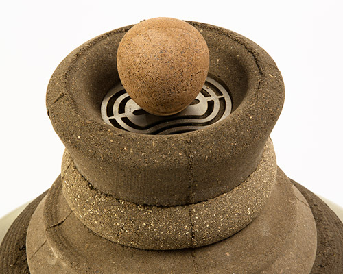 shahar kedem's stove questions the distance between the urban man and earth's soil