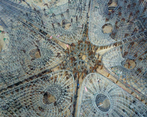 beijing's vast new airport terminal by zaha hadid architects takes shape in china