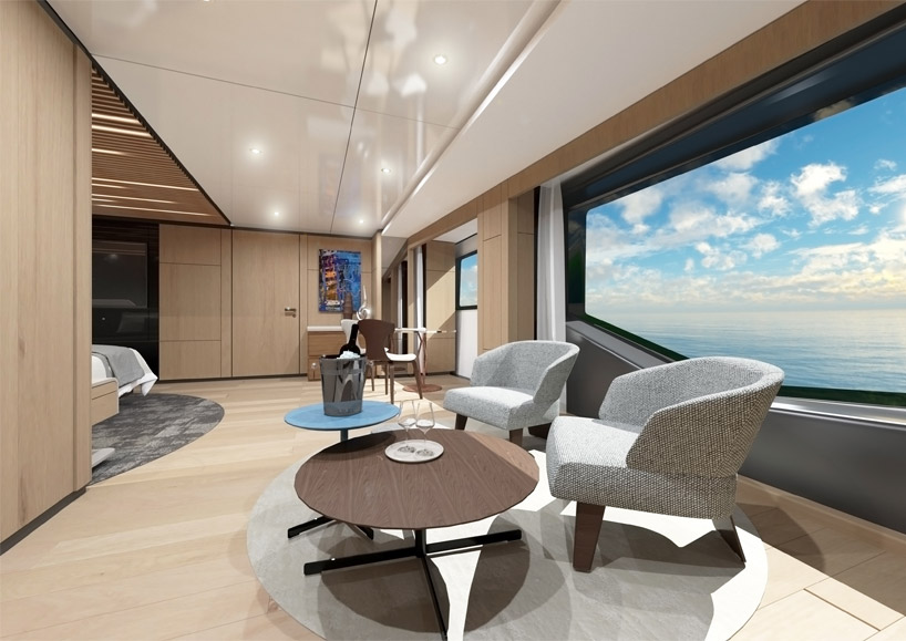 sporty-styled wider 130 yacht sails with waterside beach club