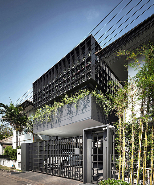 anonym studio turns old living estate in bangkok into a vibrant flower cage house