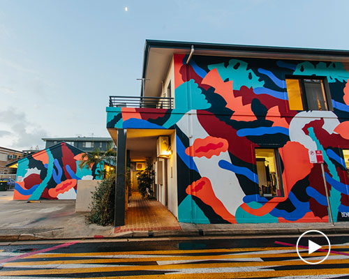 a collective of artists enliven an urban laneway with captivating murals in byron bay