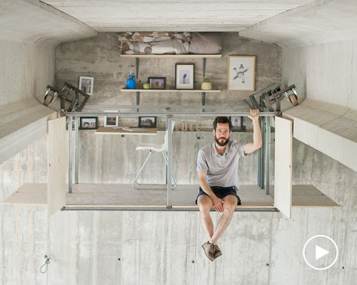 fernando abellanas suspends secret studio beneath a busy overpass