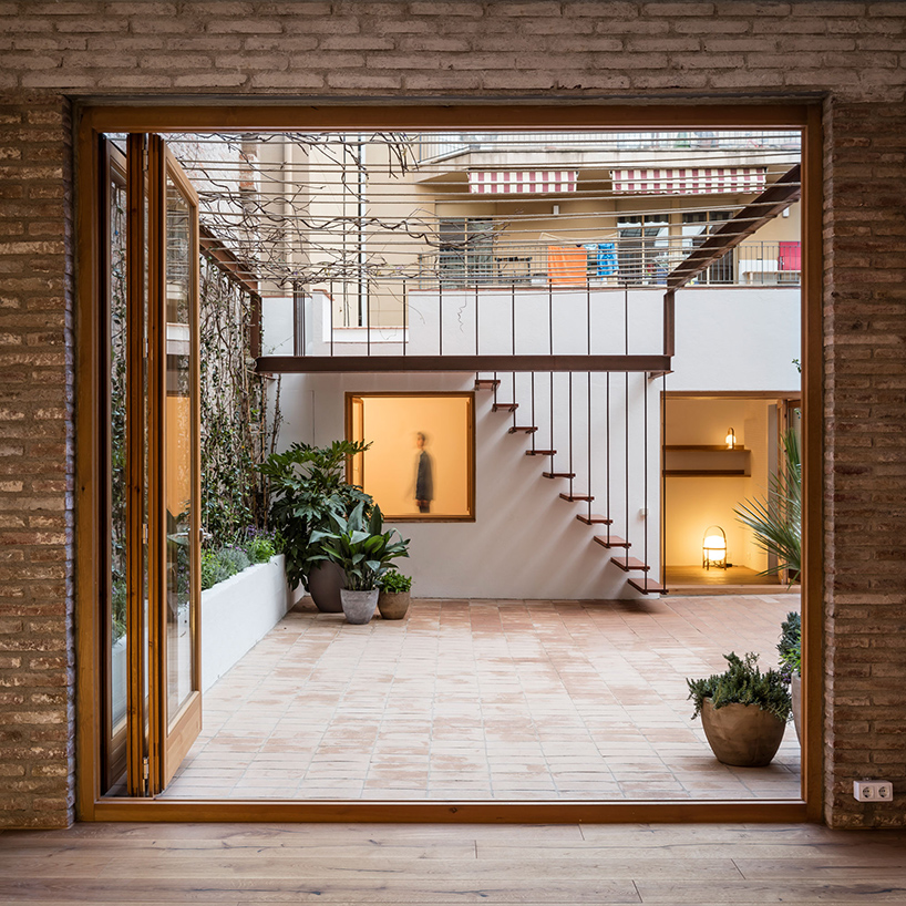 carles enrich intertwines interior and exterior for the 'gallery house' in barcelona