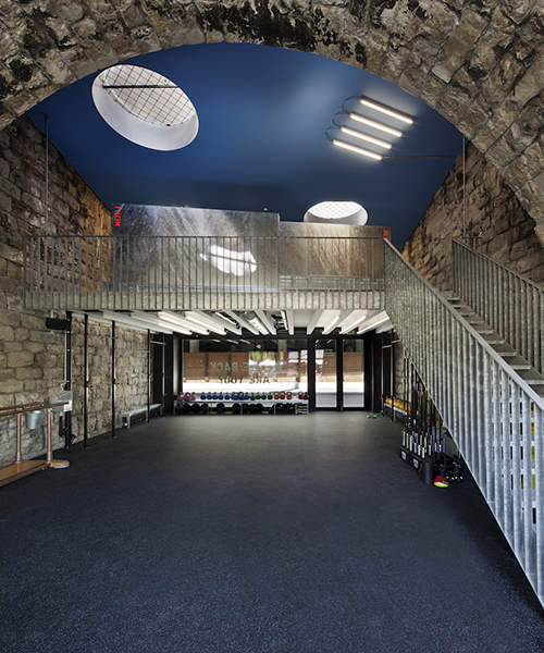 helsinkizurich embeds the 'balboa im viaduk' urban gym within a traditional rocky-backdrop