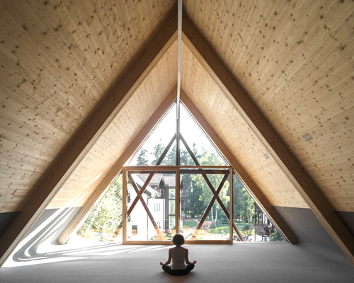 messner architects situates its newly renovated saint joseph chapel in the alpine woods