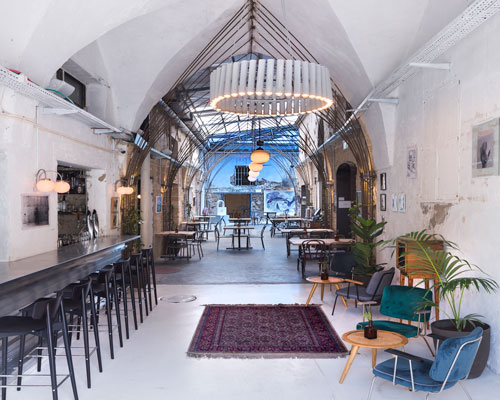 opa architects repurpose war-torn house into a rustic resto-pub in jeffa