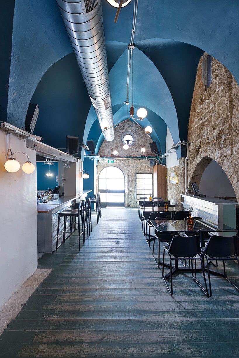 opa architects repurpose war-torn house into a rustic resto-pub in jeffa