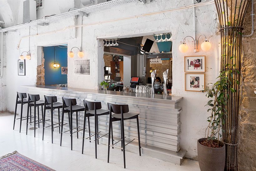 opa architects repurpose war-torn house into a rustic resto-pub in jeffa