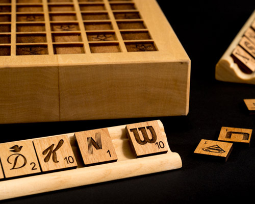emmanuel laflamme develops a scrabble edition using company logos on wooden tiles