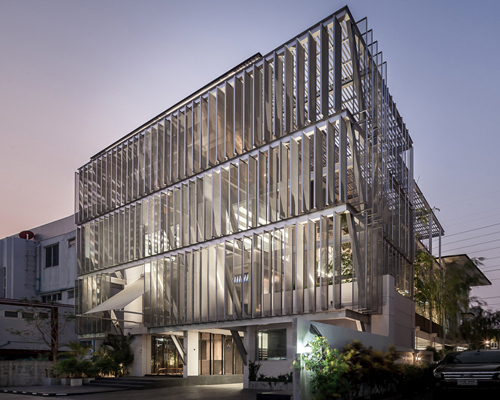 SO architects installs metal shell on DP group's newly redesigned headquarters in thailand