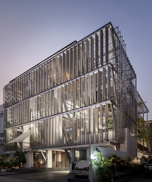 SO architects installs metal shell on DP group's newly redesigned headquarters in thailand