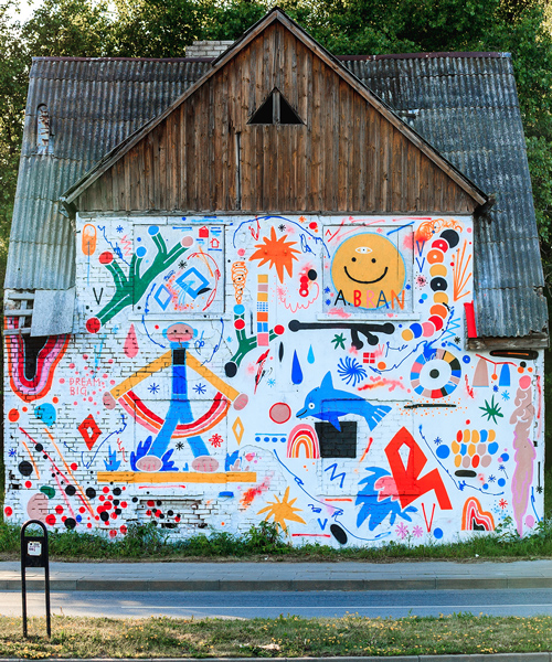 a.bran transforms abandoned house in lithuania with colorful graffiti