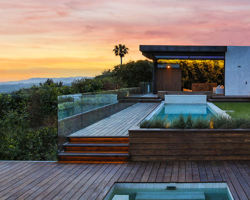 mayes' trousdale place opens up to the exterior landscape areas and views of los angeles