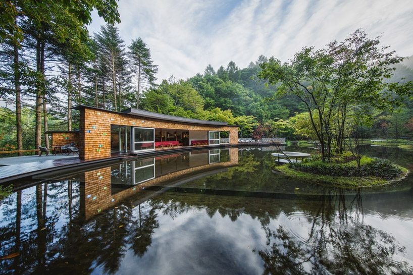 klein dytham's japanese picchio centre + ice rink resembles sweeping arcs made by skates