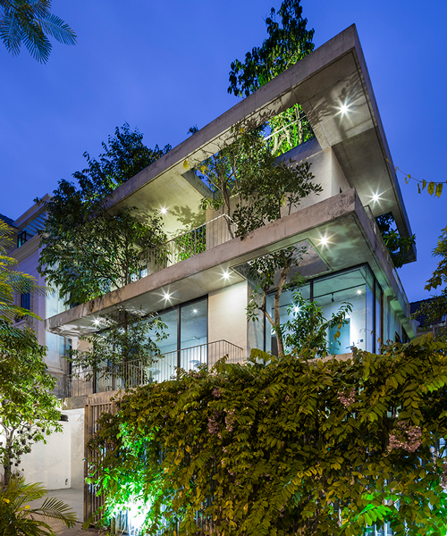 trees protrude through VTN architects' 'stacked planters house' in vietnam