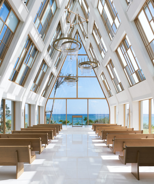 general design's light-filled wedding chapel in ginoza frames views of the japanese coast