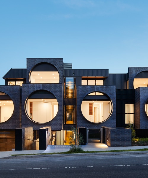 bkk architects frames cirqua apartments near melbourne with oversized, circular windows