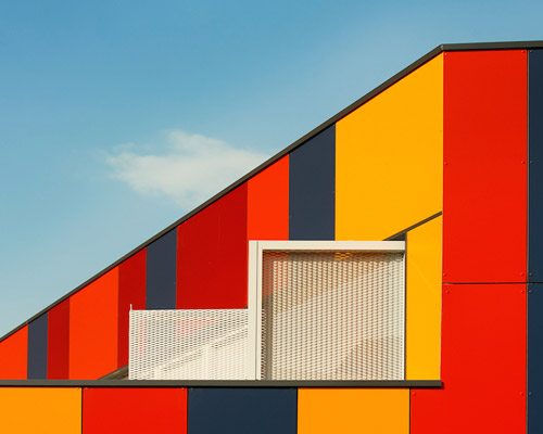 foraster's colorful rehabilitation swaps the standard cement aspects of a school in bilbao