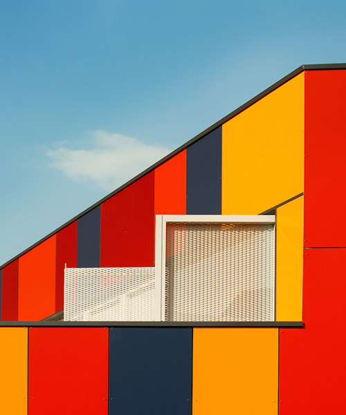 foraster's colorful rehabilitation swaps the standard cement aspects of a school in bilbao