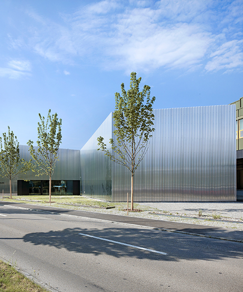 kit architects' fire station in switzerland rises as a cultivated industrial building