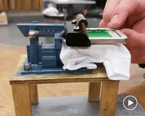 artist devin smith creates a miniature t-shirt factory with hand-made silk-screen machines
