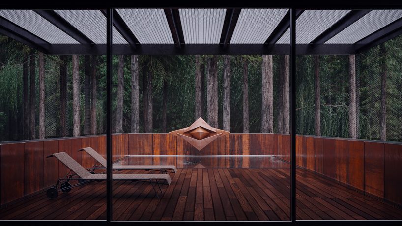 MAKHNO studio embeds corten steel house deep within ukranian forest